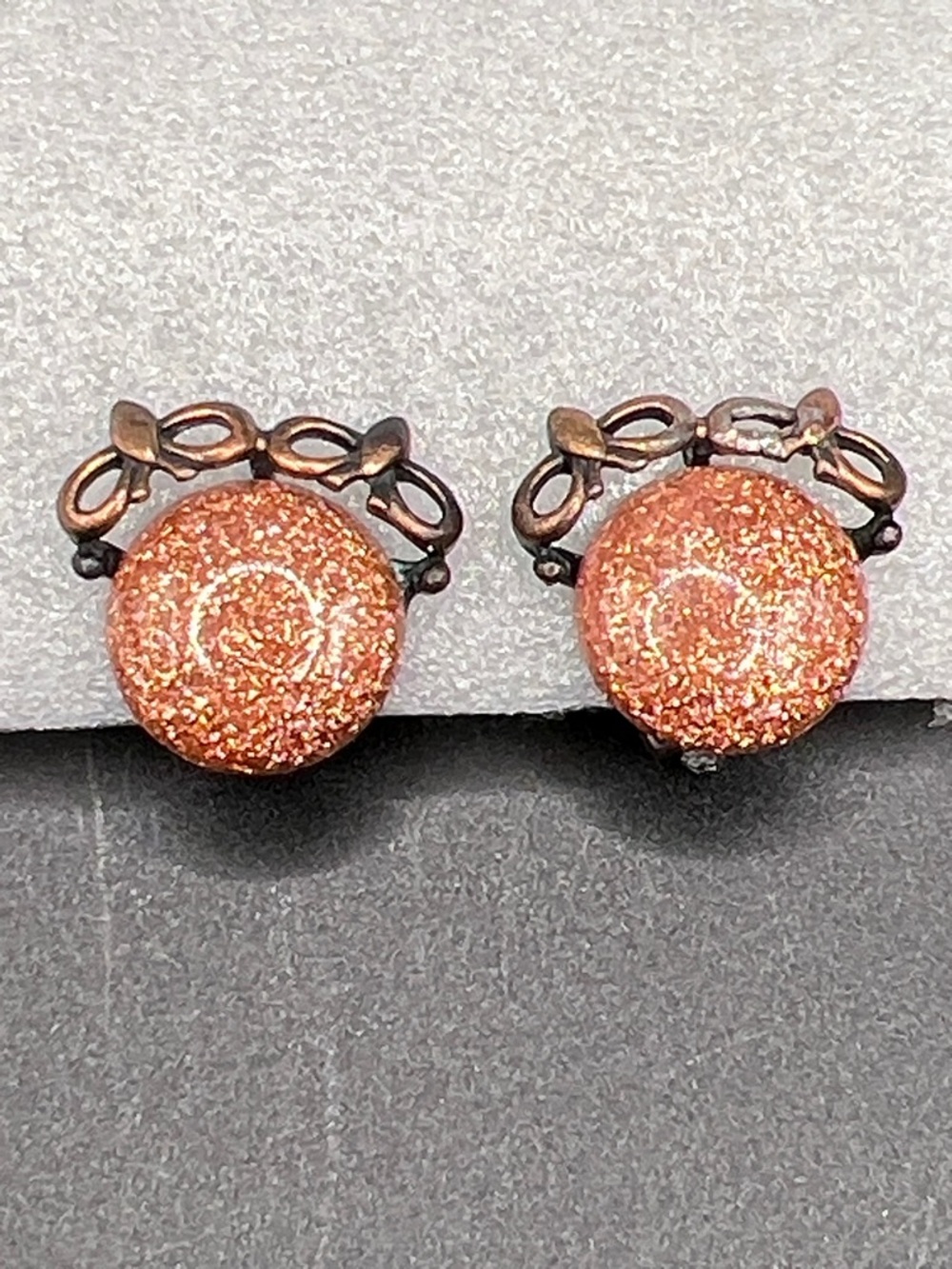 Vintage Copper Sparkle Round Earrings with Bow Accent